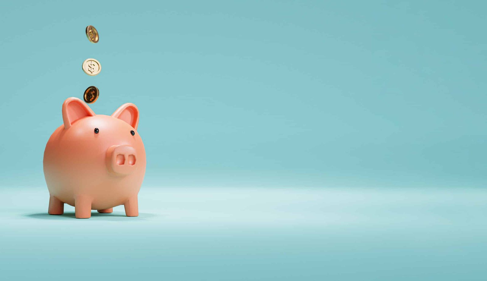 Pink piggy bank and US dollar coins falling on blue background f