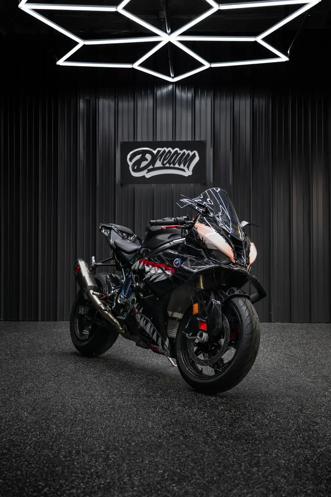 BMW S 1000 RR superbike with a custom graphic wrap under the hex lights