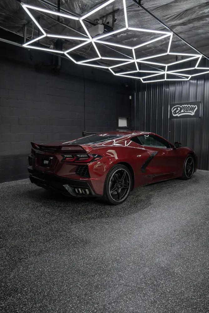 Red Corvette C8 under the hex lighting