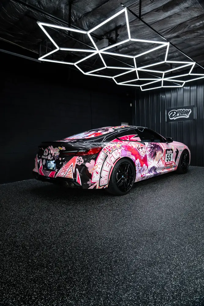 BMW M8 with a custom printed anime livery in the bay