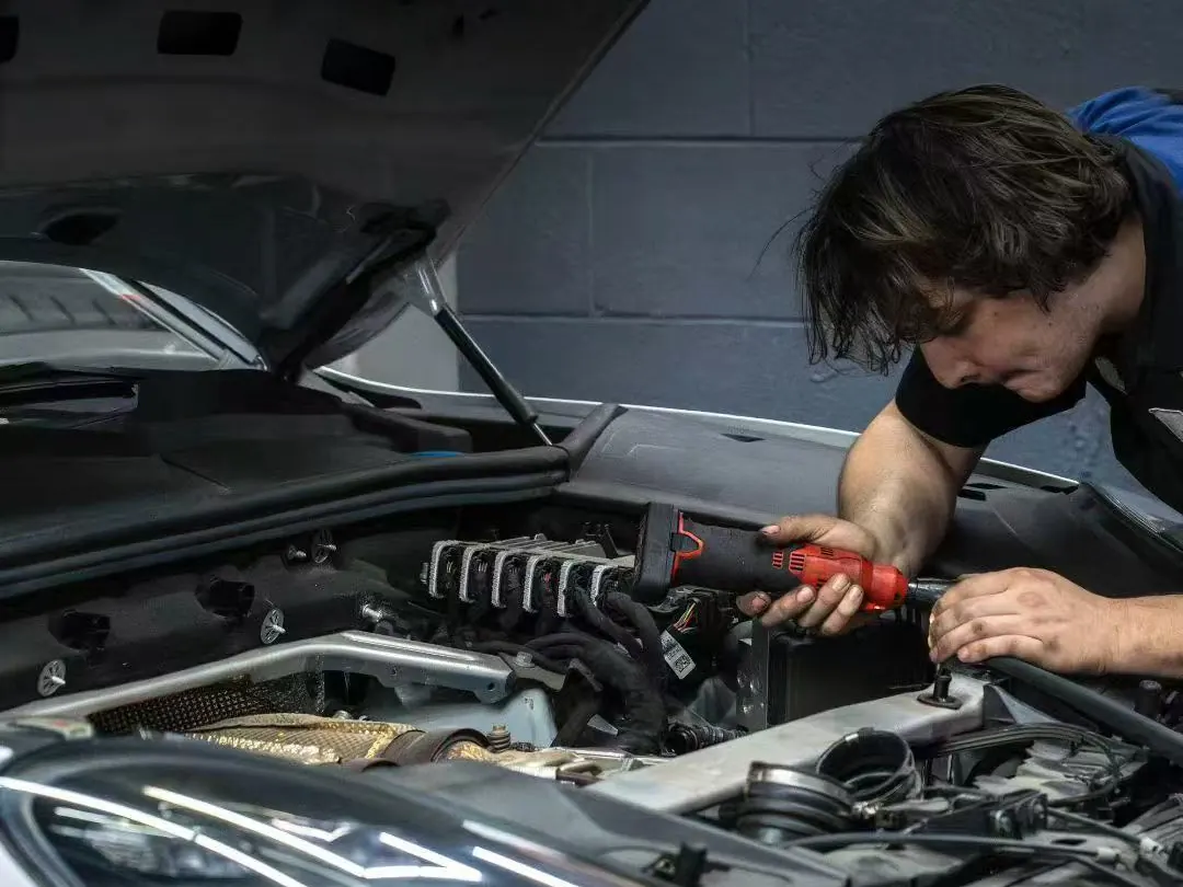 Engine bay work under way in the Dream Auto Garage service bay