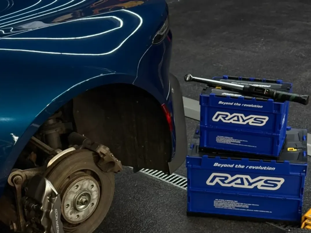 Vehicle on the lift during suspension and brake work at Dream Auto Garage