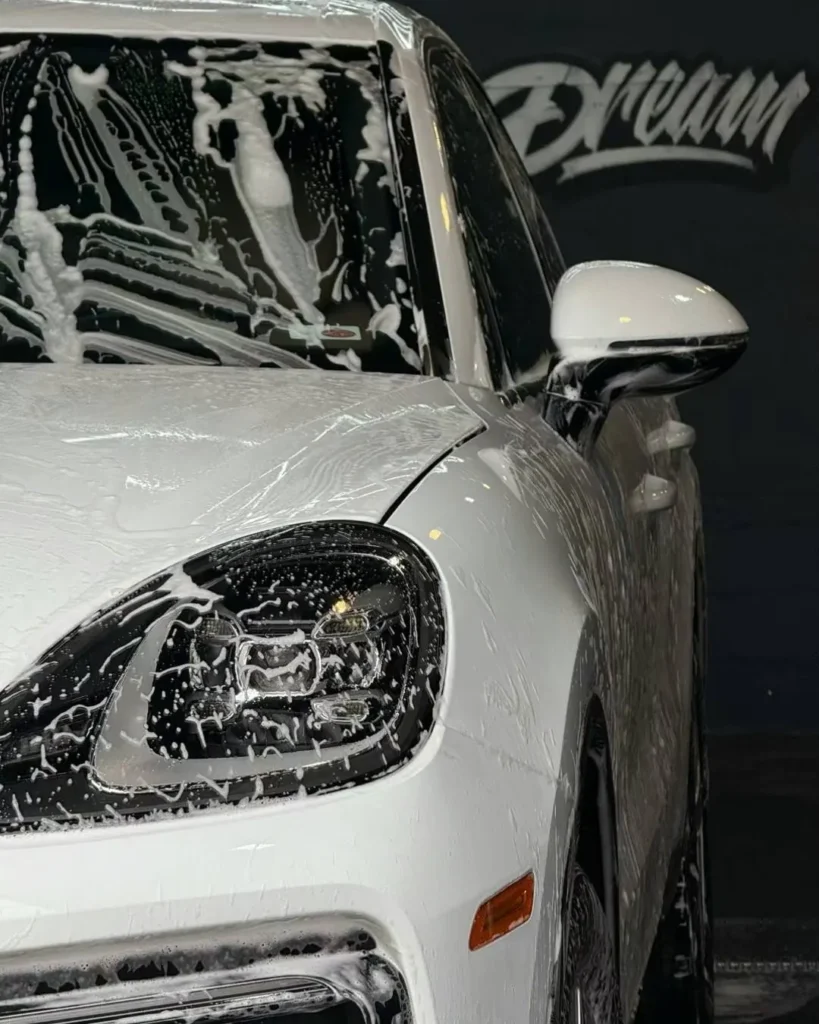 White Porsche covered in snow foam during a wash — Auto Detailing at Dream Auto Garage, Columbus OH